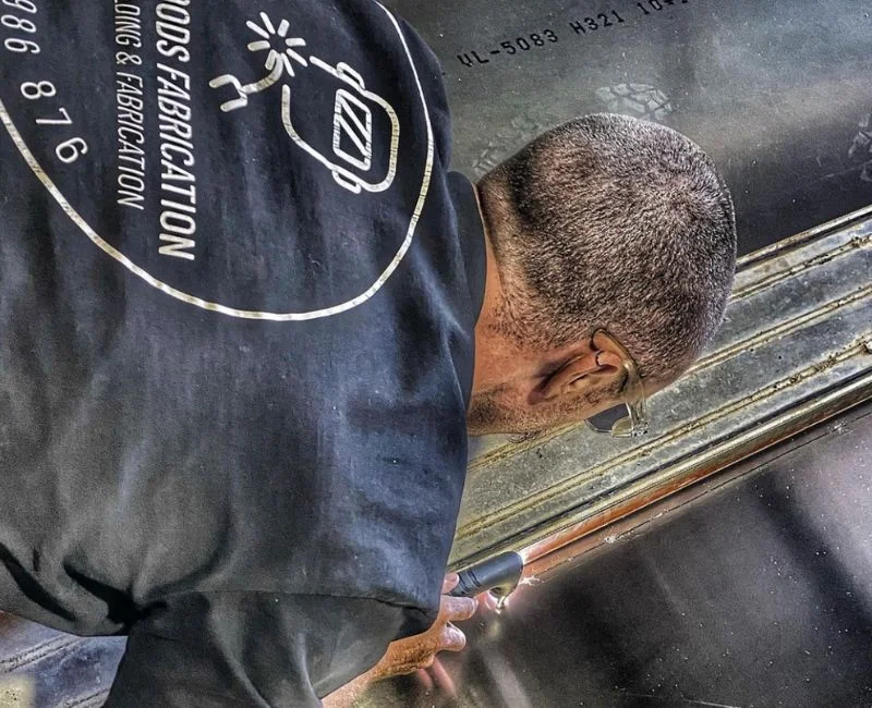 Worker fabricating a steel