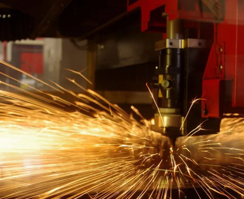 Laser cutting of metal sheet with sparks