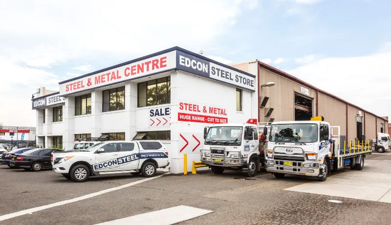 Edcon steel company cars and trucks parked outside the warehouse