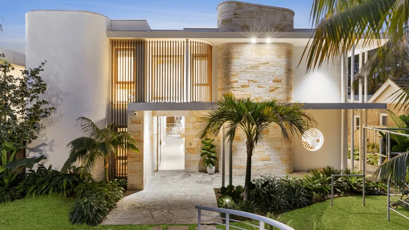 Edcon Steel - Master Builders Association Award Winner Well lit exterior of a beautiful house