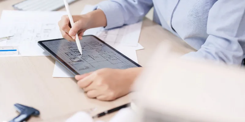 Edcon Steel - Send Us Your Drawings women drawing in the tablet