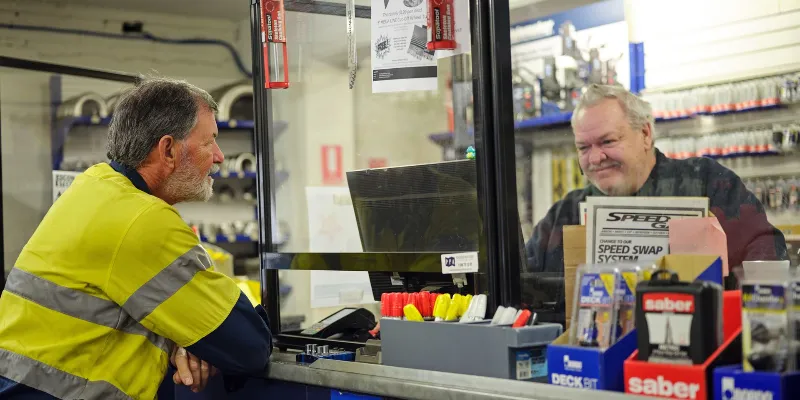 Two men working