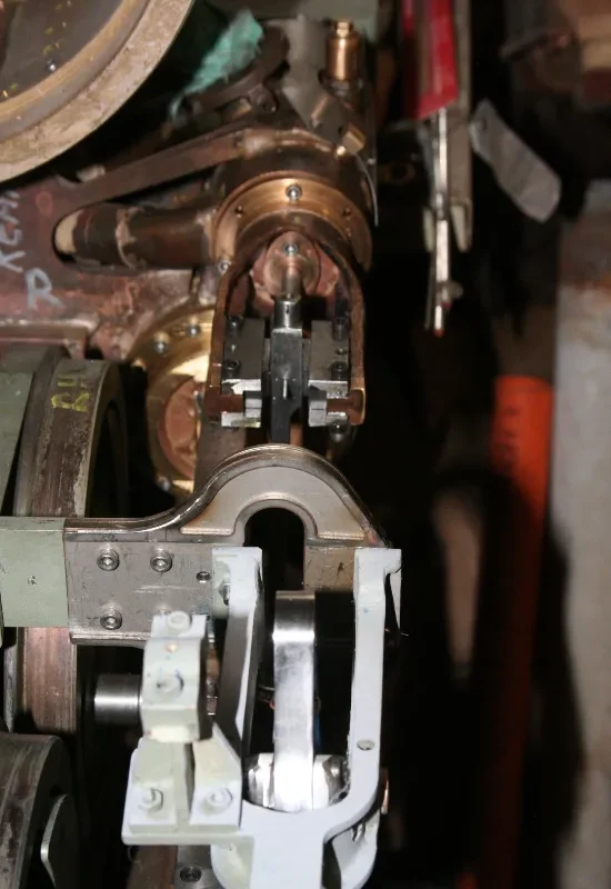 Close-up of a precision-engineered metal coupling and brake assembly on a model steam locomotive