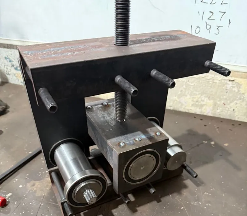 Fabricated steel frame and roller assembly for the custom bar roller.